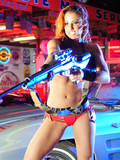 tight-bodied-busty-action-babe-with-gun-shows-off-her-incredibly-sexy-body