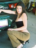Very attractive black haired lady Alexa poses in the garage and by the door