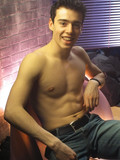 Sexy dark haired young guy takes off his jeans and poses in tight white briefs