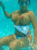 Sexy pornstar in tiny bikini was recorded on camera in the swimming pool