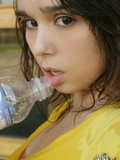 black-haired-chick-in-yellow-t-shirt-a-white-skirt-gets-wet-from-top-to-bottom