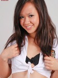 Asian schoolgirl strips down to her black lingerie and white stockings then shows her pussy