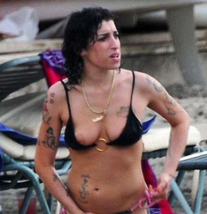 Topless Amy Winehouse Showing Her Nice Tits And Multiple Tattoos On The Beach