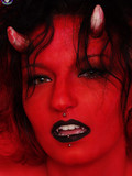 nude-deviless-shows-her-big-round-boobs-pierced-pussy-and-tattooed-belly-in-the-red-light