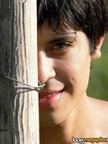 Completely nude petite black haired boy jerks his dick and cums in the open air