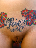 Nude alternative blonde shows her tight pink hole and multiple tattoos all over her body