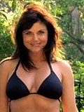 Dark haired lady Tiffani Aamber Thiessen looks incredibly sexy in black bikini top