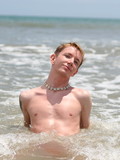 young-and-sexy-surfer-shows-off-his-tight-teen-body-at-the-ocean-side