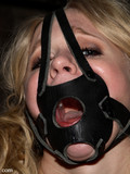 Charming blonde with color tattoos on her slender body gets bound and tortured