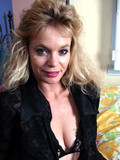 slim-aged-blonde-strips-down-to-her-black-lace-lingerie-and-flashes-her-snatch