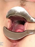 Mature doctor puts his fingers in girl's pink pussy then inserts a speculum