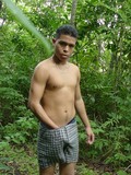 exotic-teenage-guy-strips-down-to-his-long-boxers-somewhere-in-the-forest