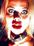 There is fear in big eyes of this big boobed blonde in blue fishnet suit