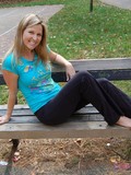 playful-blonde-chickie-kelly-takes-off-her-sneakers-and-shows-her-bare-feet-outdoors
