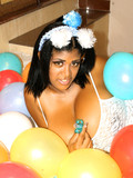 Playful black haired girl in white dress gets her unbelievably big tits out while posing in balloons