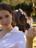 Small titted spring fresh brunette girl shows her body while walking the farm