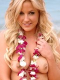Young blonde with sexy boobs and sand covered shaved pussy takes off her bikini on the beach