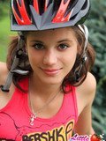 Brown haired pigtailed teen cutie gets nude in the open air after riding a bicycle