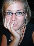 Smiling milf girlfriend in glasses makes her eyes on you and gives a close-up of her hairy pussy