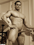bodybuilder-shows-off-his-breathtaking-body-on-the-beach-and-exposes-his-dick-indoors