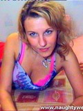 Webcam blonde with hairless snatch and nice tits takes off her red hat and lingerie