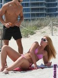 Blonde latina in pink bikini gets picked up on the beach and fucked in her bald tight pussy
