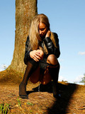 Tall leggy girl in jean mini skirt and high nylon socks pisses in the woods