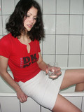 brunette-girl-with-bald-pussy-lifts-up-her-tight-white-mini-skirt-and-pisses-in-the-glass