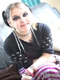 Amateur gothic girl with rich make-up shows her small titties, clit and buttocks