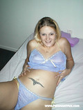 Pregnant lady takes off her blue lingerie and fucks herself with metal dildo