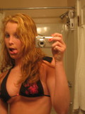 Amateur blonde strips off her lingerie and spreads her legs showing her bald spot