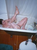 Brunette chick with natural tits and trimmed pussy takes a bath in front of spy camera