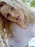 blonde-lady-in-transparent-white-t-shirt-and-panties-poses-outside-showing-piercing-on-her-face