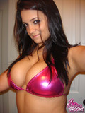 Big titted cute faced brunette in tight pink bra makes photos of her own