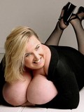 chubby-blonde-shows-her-bomb-size-hooters-without-removing-her-black-dress