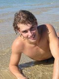 this-young-curly-haired-male-model-loves-to-pose-outdoors-topless-and-in-sunglasses