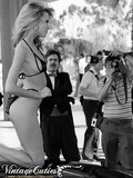 Sexy retro babe spreads her legs and shows her pussy after modeling at the car show