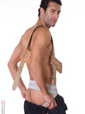Raven haired handsome male model strips out of his uniform and sexy jocks