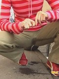 bad-girls-wets-her-pants-in-the-middle-of-the-street-in-public-at-daytime