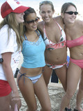 playful-chicks-in-wet-bikinis-go-party-on-the-beach-seducing-everyone-around