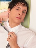 Smiling black haired boy gets totally nude and shows his young sausage